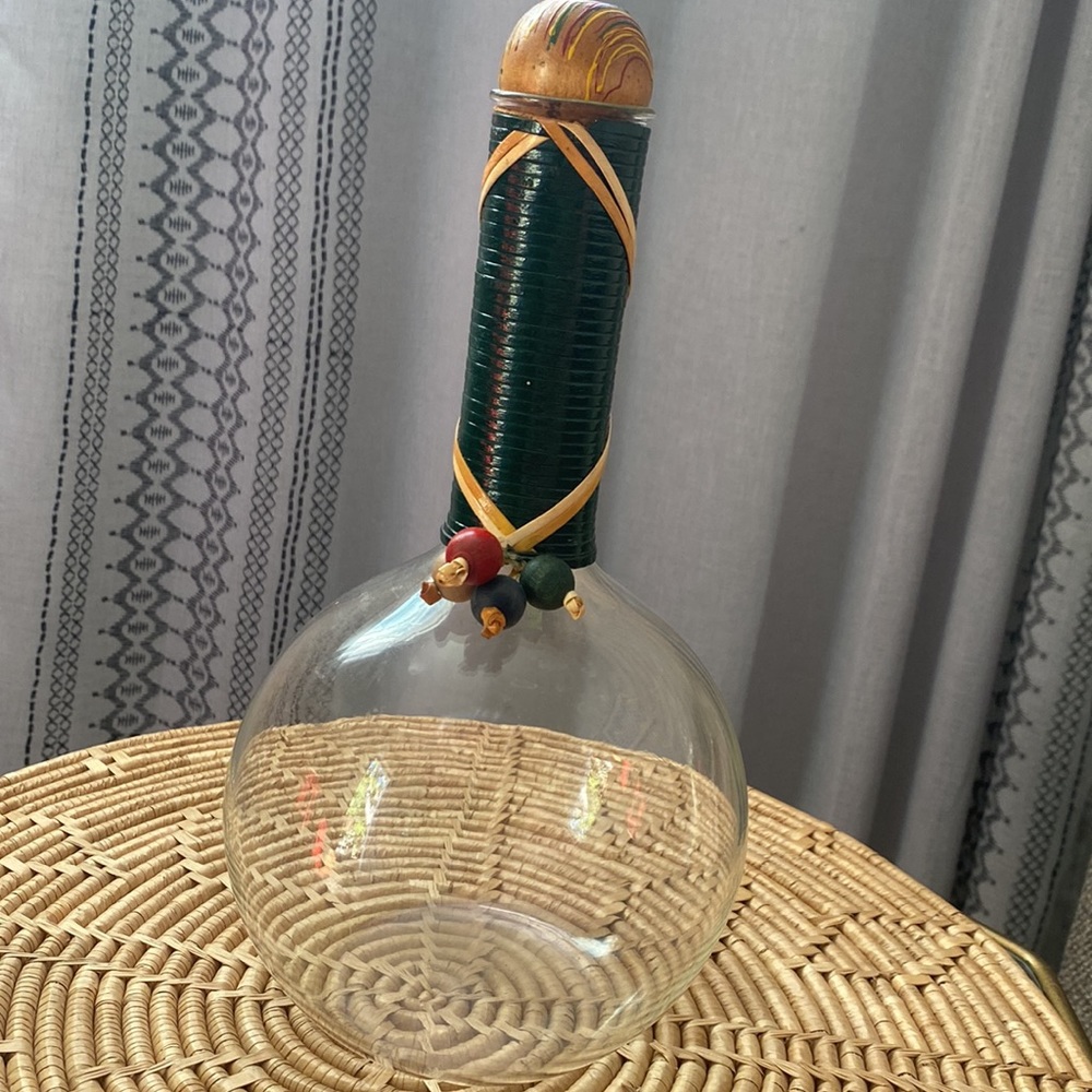 Vintage decanter with wood beads and cork bottle stop